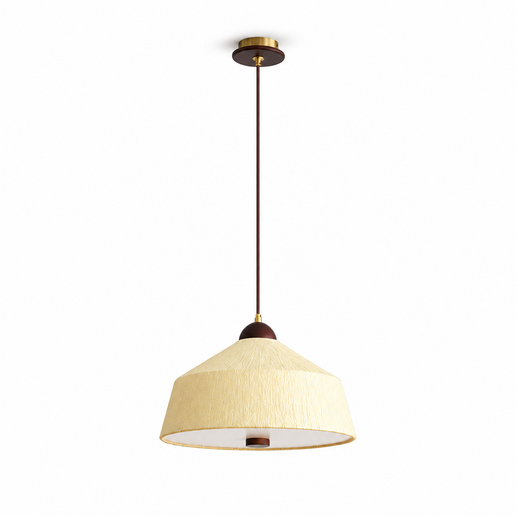 This Clérachic pendant shown in soft yellow rice paper, its cone shade set beneath a brass canopy on a plain backdrop.
