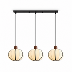 Three of these Clérachic pendants cluster from one black linear bar, their cream ribbed shades glowing in a row.
