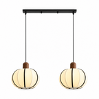Two of these Clérachic pendants hang from a black linear bar, cream ribbed shades glowing side by side.