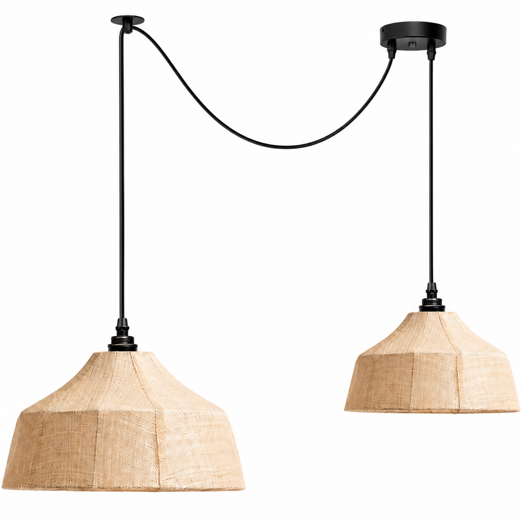 Two Clérachic pendants hang at staggered heights, their cords crossing from a pair of round ceiling plates.