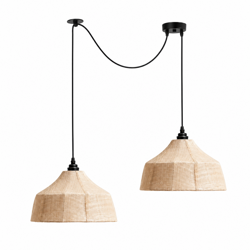 Two Clérachic pendants drop to different heights, their cords spread wide from two ceiling plates.