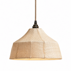 Close view from below of a lit Clérachic pendant's faceted woven shade and bronze cord fitting.