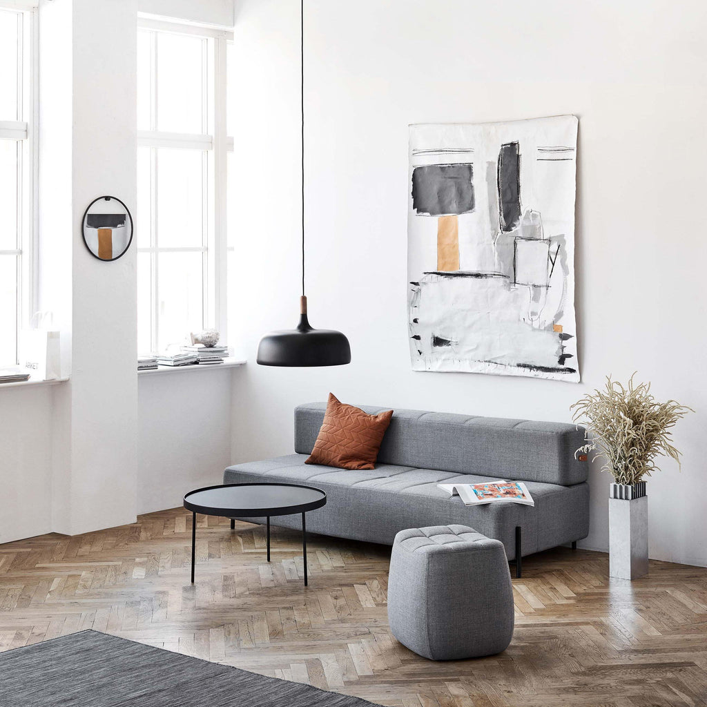 Acorn pendant light shown lit with a warm globe bulb
