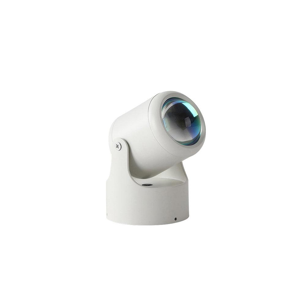 Smaller in frame, this white Clérachic projection lamp sits angled and unlit against a plain backdrop.