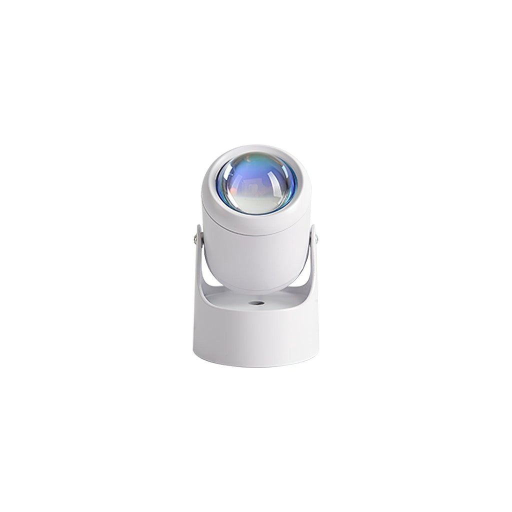 Seen from above, this white Clérachic projection lamp tilts its lens down, unlit, against a plain backdrop.