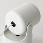 Close-up of the cable entry and swivel hinge on this white Clérachic projection lamp's base.