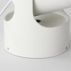 Close-up from above of this white Clérachic projection lamp's rotating cup joint, with the USB cable visible.