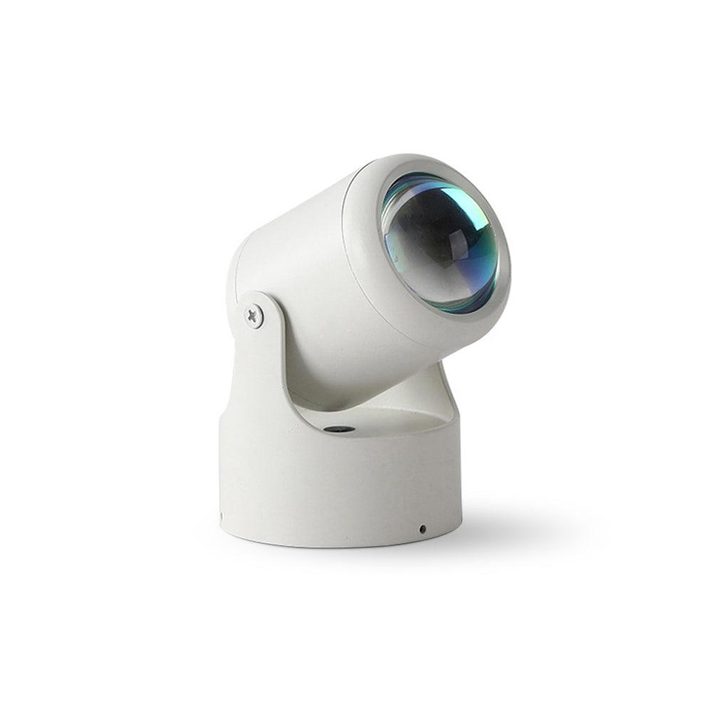 This white Clérachic projection lamp tilts its lens forward, unlit, on a plain backdrop.