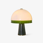 Clérachic dome table lamp shot on a plain white background, showing the green-rimmed glass shade and tapering marble base.
