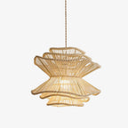 Against a white backdrop, this Clérachic pendant shows its spinning-top shape narrowing between two wave-edged rattan tiers.