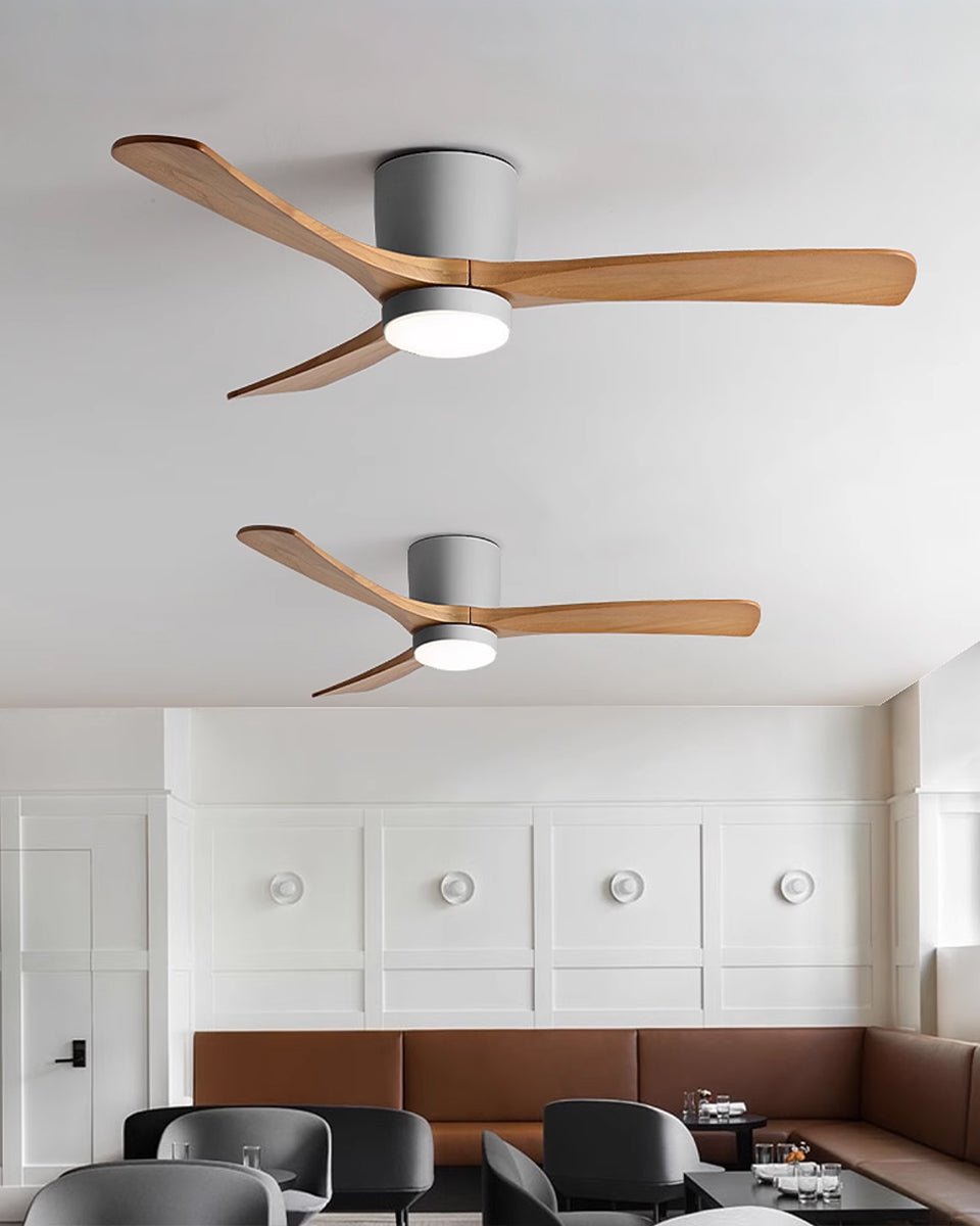 Wood-blade ceiling fan and light installed in a modern space