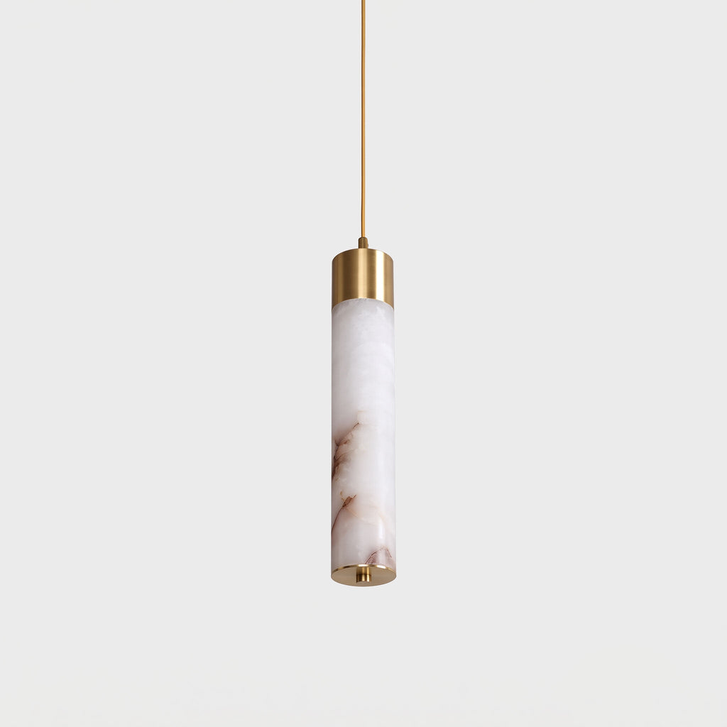 A close view of this Clérachic pendant's single alabaster tube, its warm veining lit beneath a brass cap.