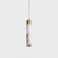 A close view of this Clérachic pendant's single alabaster tube, its warm veining lit beneath a brass cap.