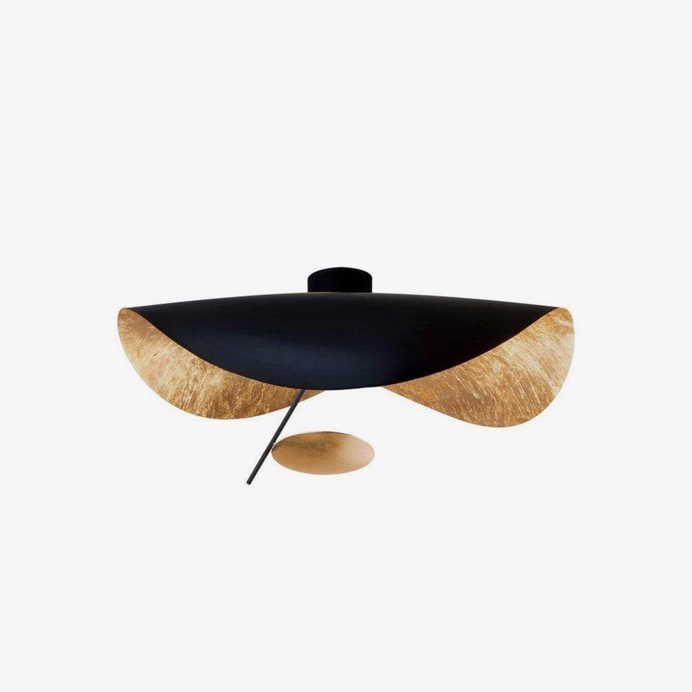 Curved steel disc ceiling light glowing warm overhead