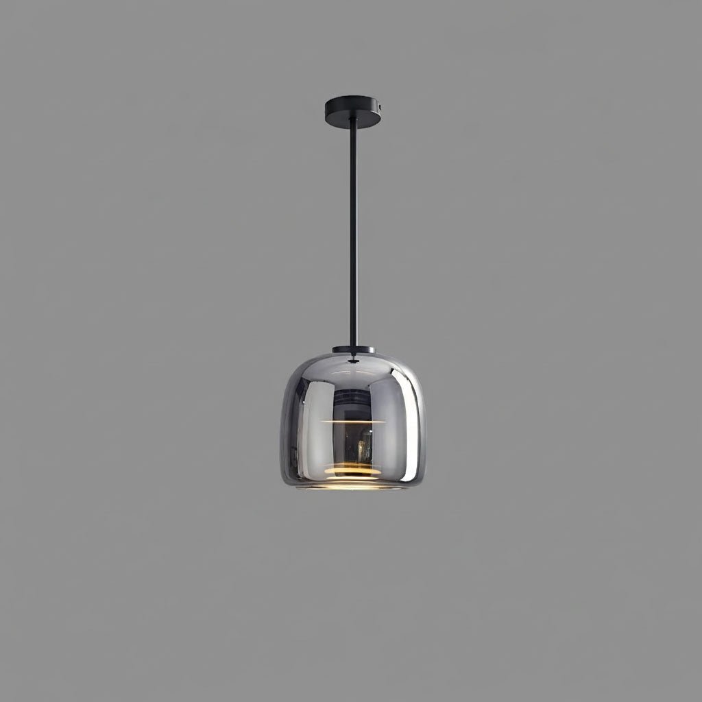 Smoked glass globe pendant light glowing softly above a modern interior