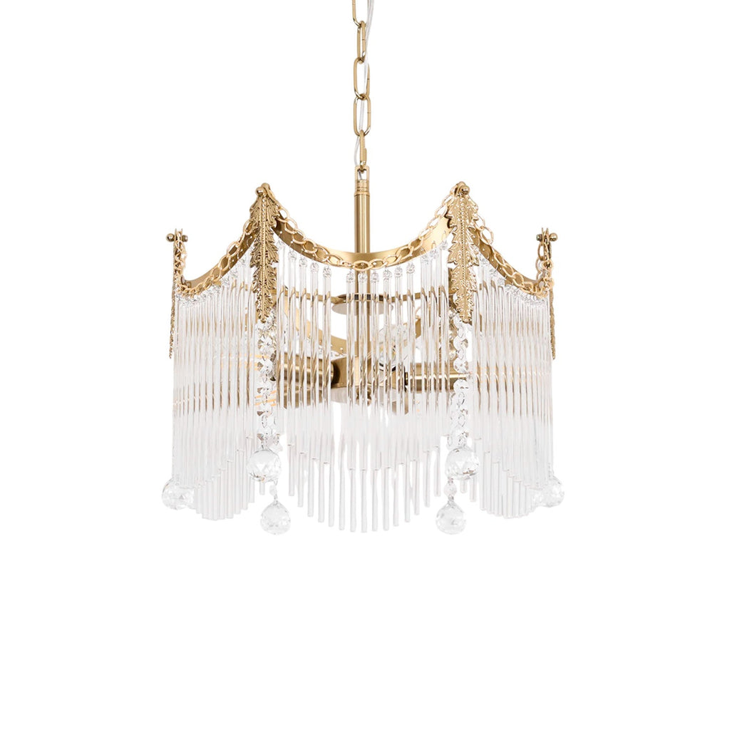 Copper-finish chandelier with clear glass shades glowing warmly above a dining table