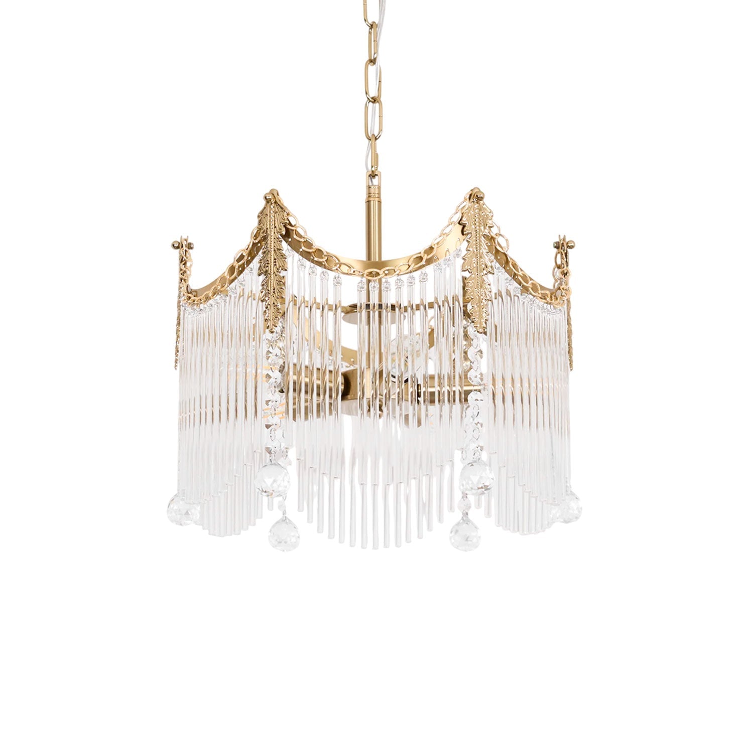 Copper-finish chandelier with clear glass shades glowing warmly above a dining table