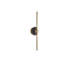Clérachic wall light shown small on white, a dark marbled stone disc set halfway up its slim brass bar.