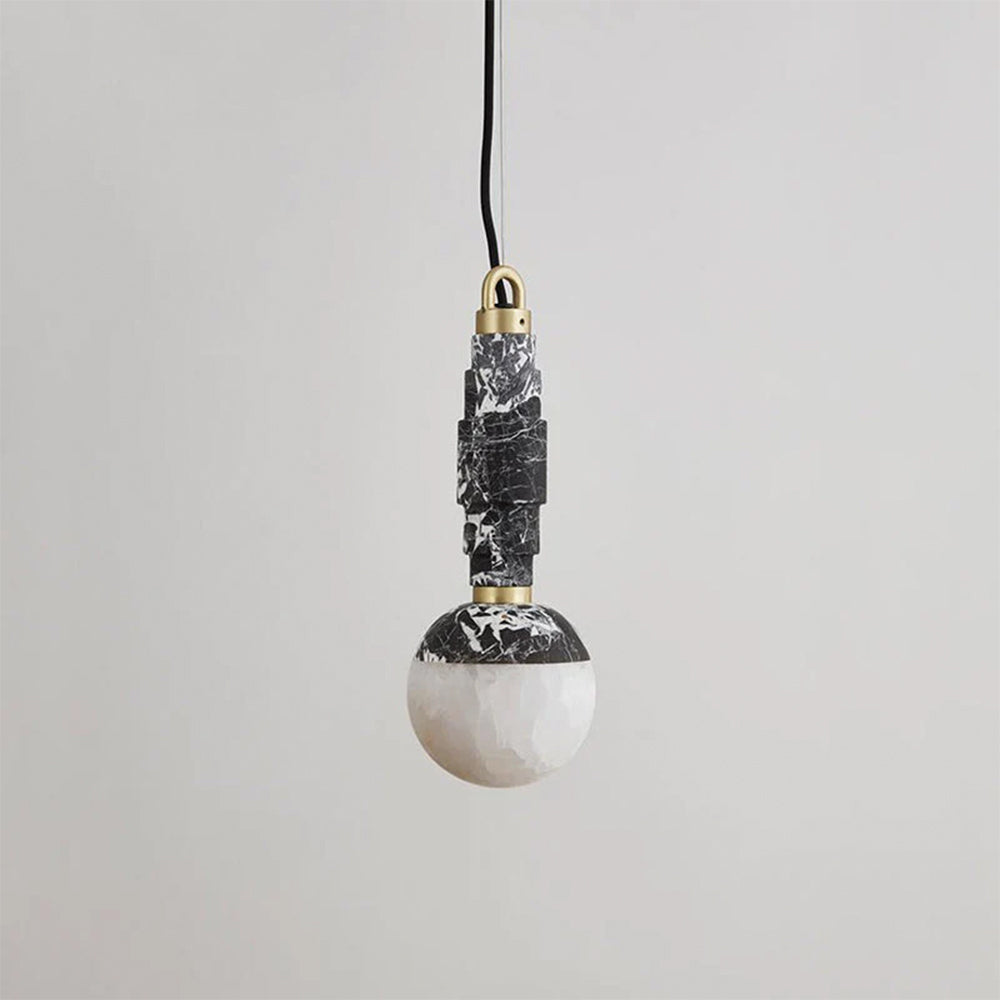 Marble and alabaster pendant lamp in black and white veined stone with brass fittings, shown unlit.