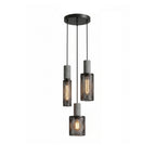 Cluster of three cement mesh pendant lights at staggered heights