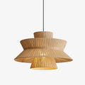 Lit against a white backdrop, this Clérachic pendant shows its ruffled linen rim flaring below a fluted cap.