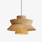 Lit against a white backdrop, this Clérachic pendant shows its ruffled linen rim flaring below a fluted cap.