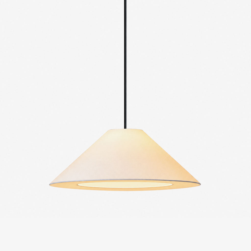 This Clérachic pendant shows its beige fabric cone shade and adjustable cord against a plain backdrop.