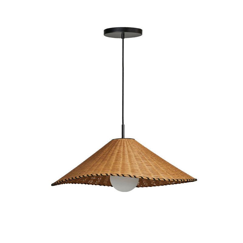 On a plain backdrop, this Clérachic pendant hangs unlit, its scalloped rattan trim shown in profile.