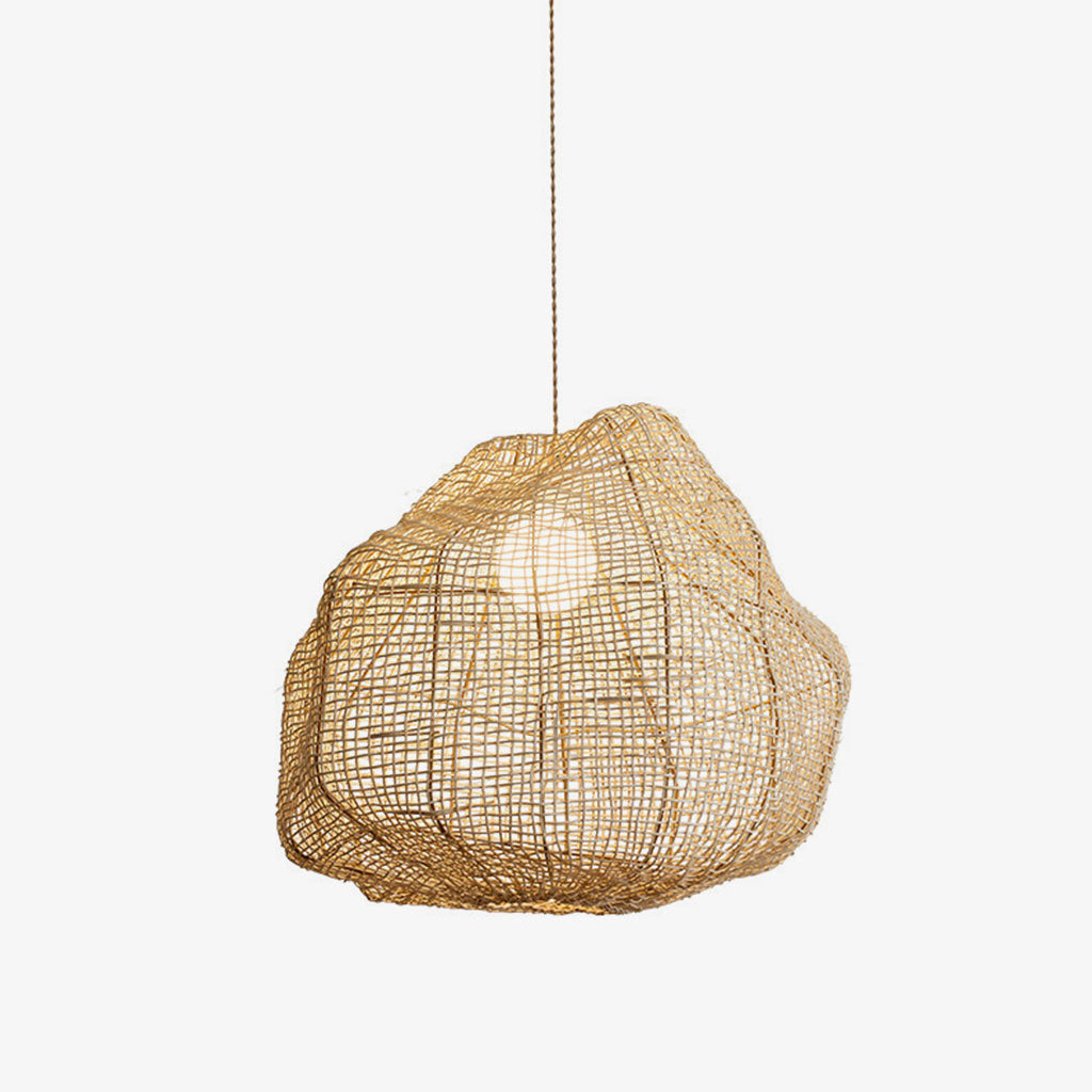 Studio view of this Clérachic pendant, its cross-hatched rattan cane wrapped around an exposed bulb.