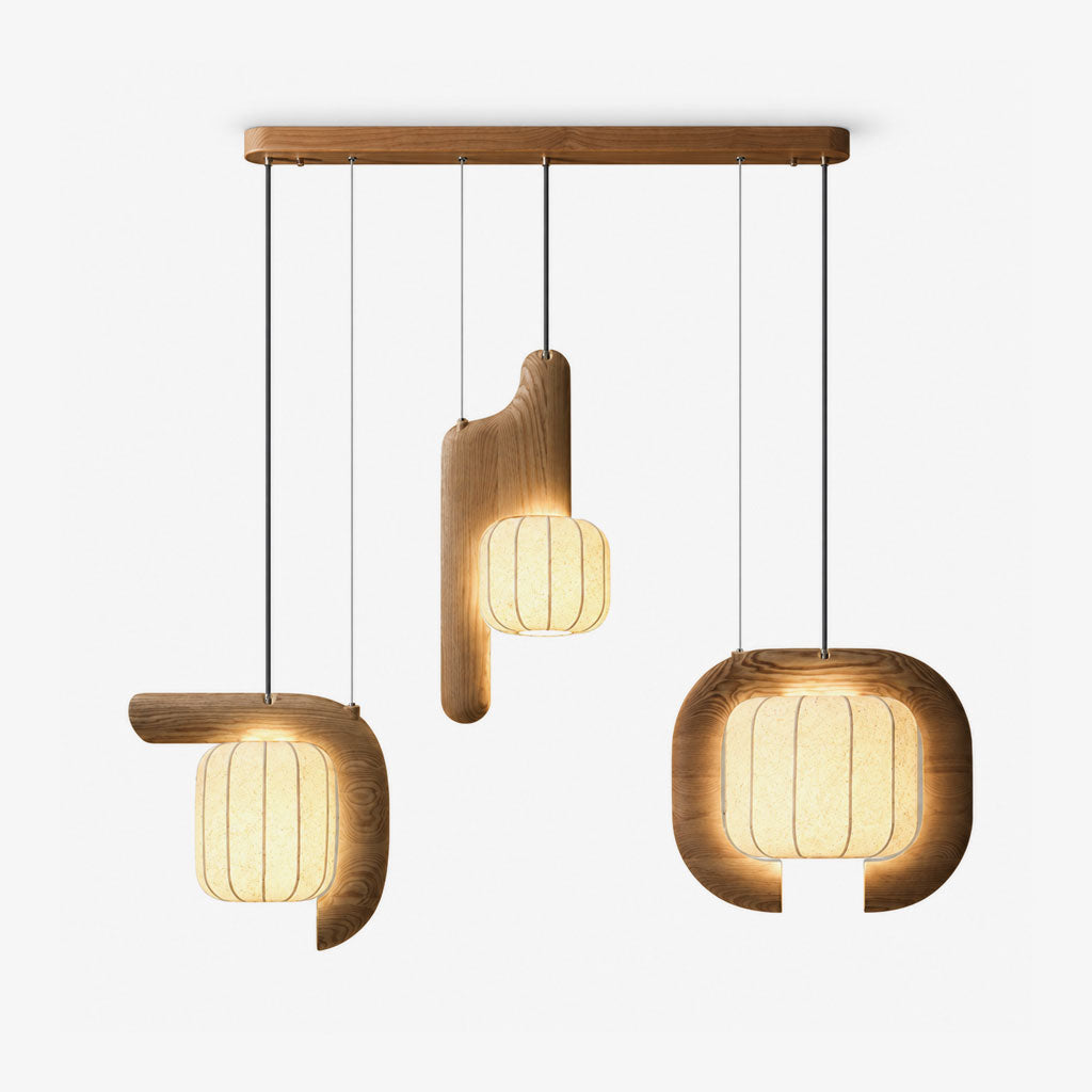 Studio shot of this three-light Clérachic fixture in light wood, its vertical, bent and closed-loop shades all glowing.