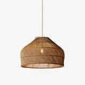 Product view of this Clérachic pendant, its diagonal rattan weave and fringed base rim shown against a plain background.