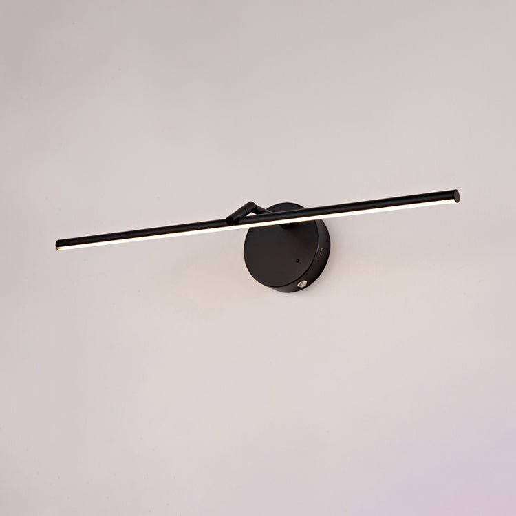 A black-finish Clérachic wall light shown unlit on a plain wall, its slim bar crossing the round canopy at an angle.