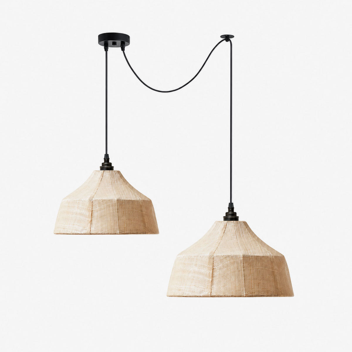 Two faceted woven Clérachic pendants of matching size hang side by side against an off-white backdrop.
