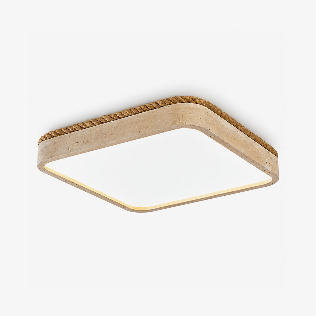 A Clérachic flush mount ceiling light in yellow travertine, its square edge wrapped in wound jute rope, shown against a plain backdrop.