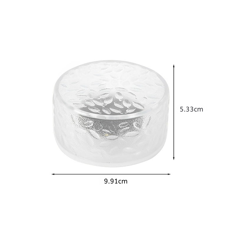 A clear textured glass container with dimension markings showing a height of 5.33cm and a diameter of 9.
