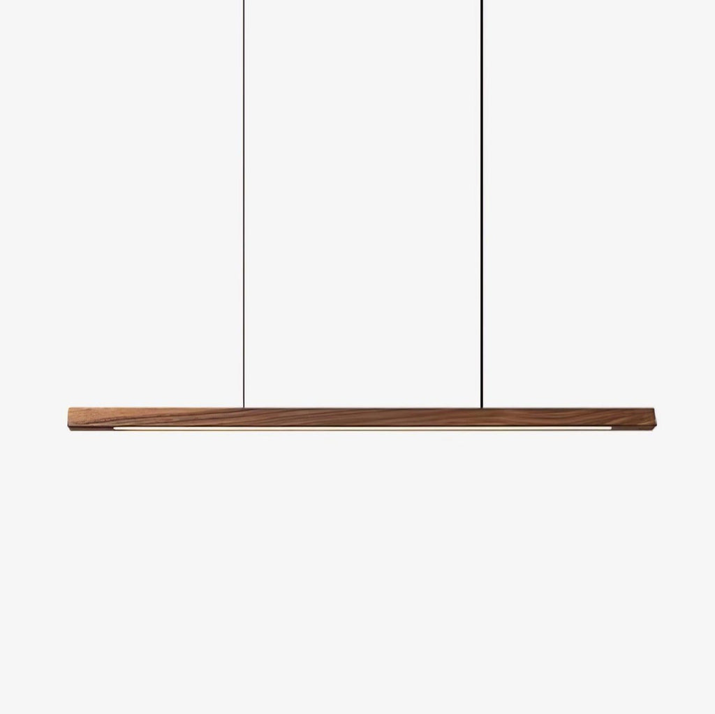 Wooden linear pendant light casting soft warm light in a room