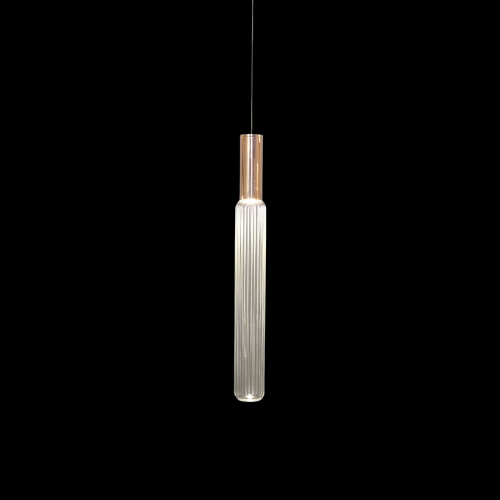 A copper-toned gold rod suspends this Clérachic pendant's fluted glass cylinder.
