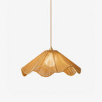 Shown on a plain background, this Clérachic pendant's wavy, scalloped hemp-rope hem glows warm from within.