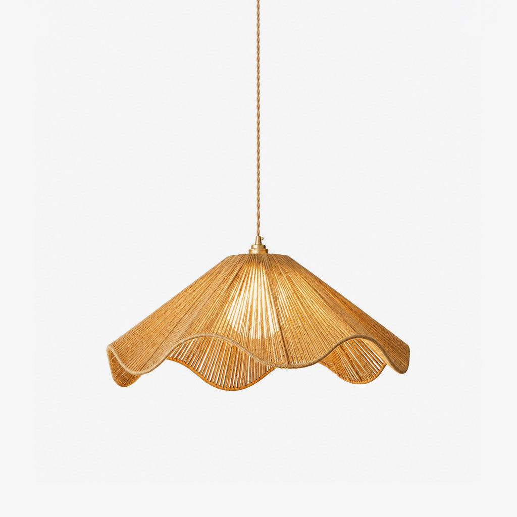 Shown on a plain background, this Clérachic pendant's wavy, scalloped hemp-rope hem glows warm from within.