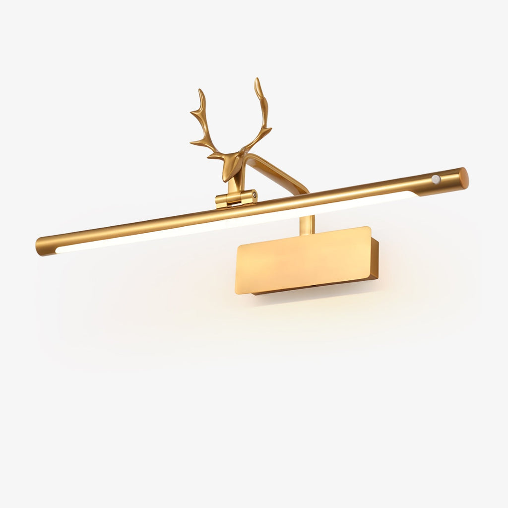 Stag horn wall sconce shining warm light onto a wall-hung painting