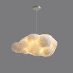 Elongated and lit, this Clérachic cloud-shaped pendant glows against a darker grey backdrop.