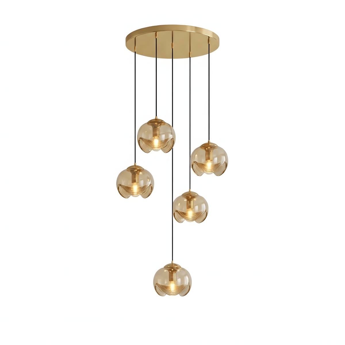 Six small round amber glass shades hang at staggered heights from a gold ceiling plate, this Clérachic fixture shown on white.