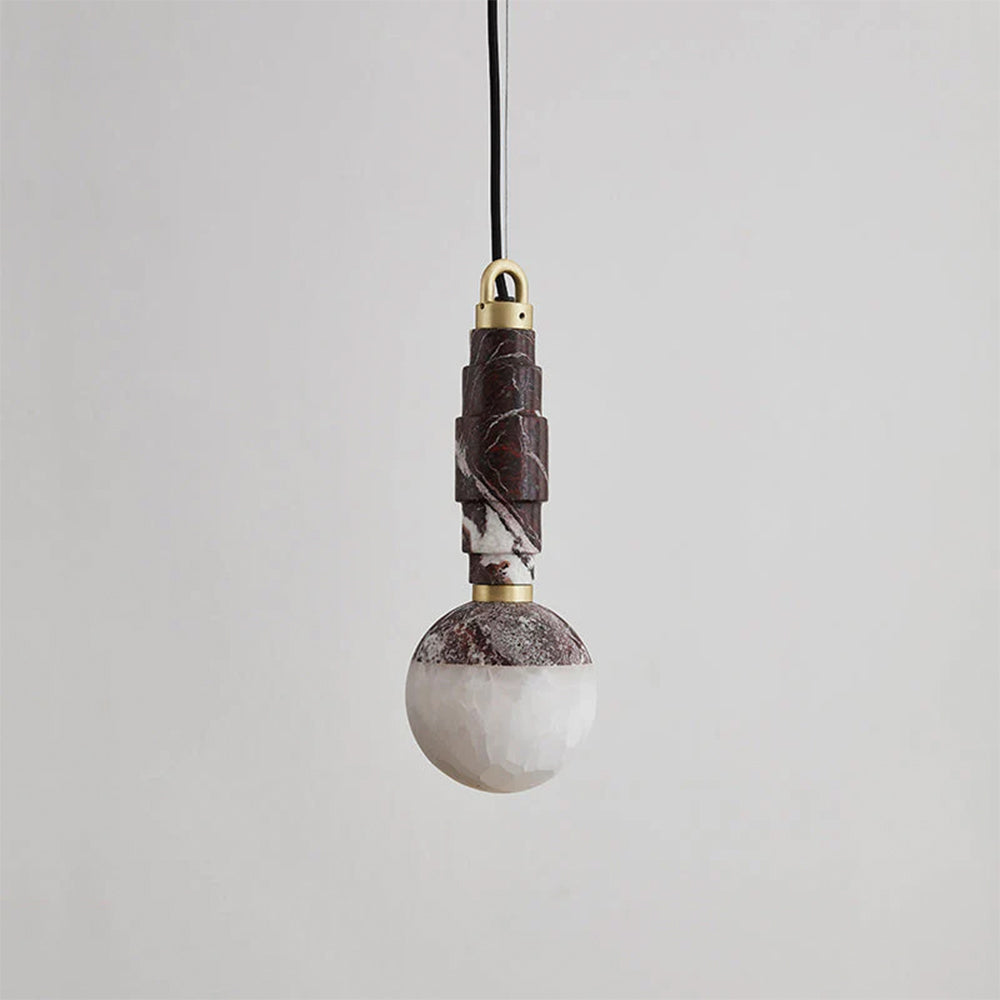 Burgundy marble version of the pendant lamp, its stacked stone stem meeting a creamy alabaster globe.