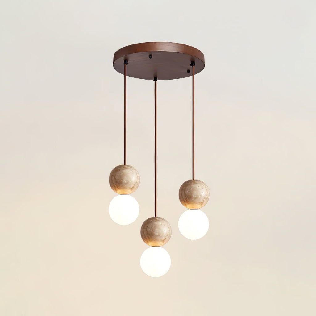 Five cords cascade travertine and glass spheres at staggered heights from this Clérachic pendant's round canopy.