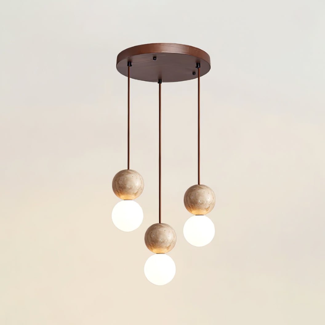 Five cords cascade travertine and glass spheres at staggered heights from this Clérachic pendant's round canopy.
