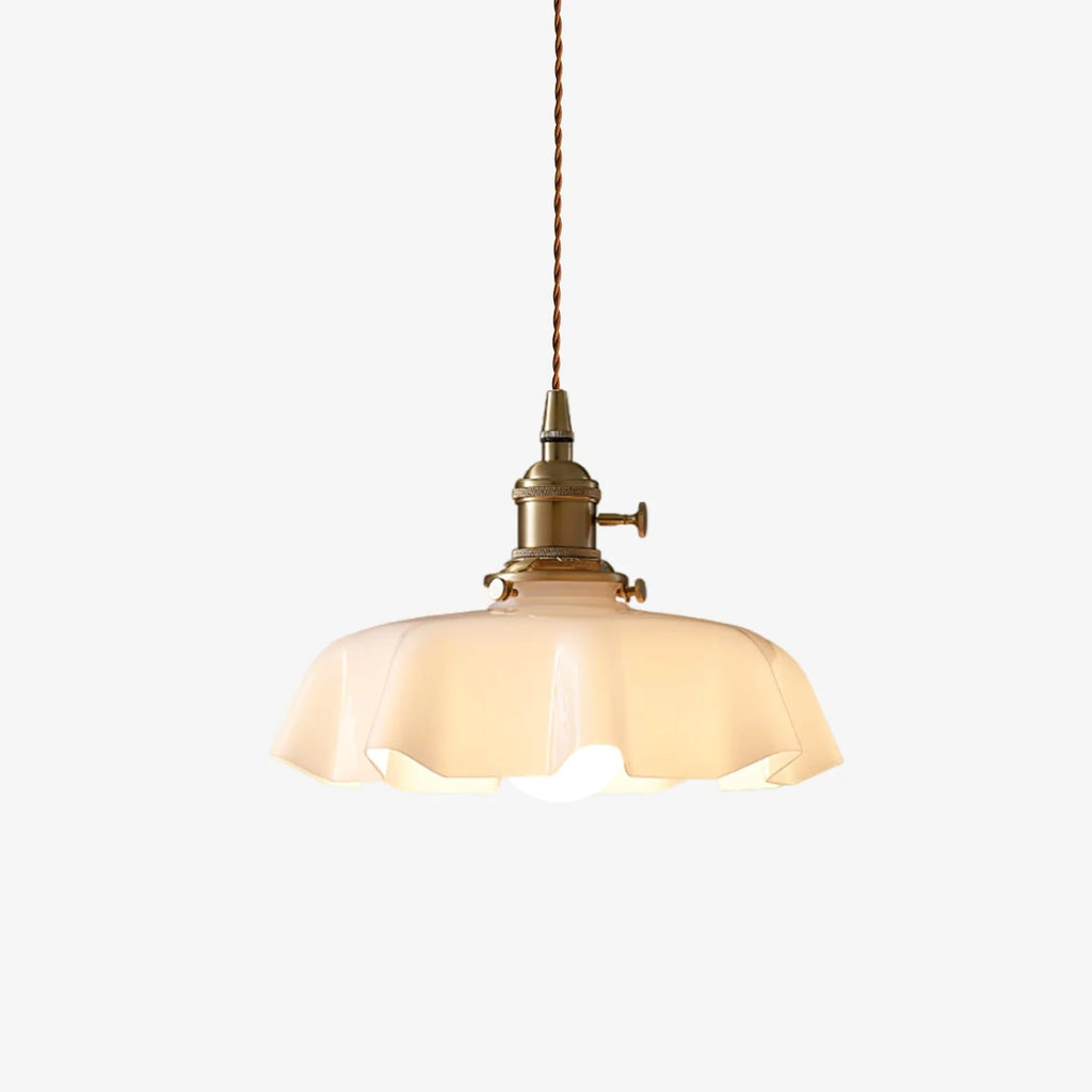 French pendant light with pleated glass shade casting dappled light