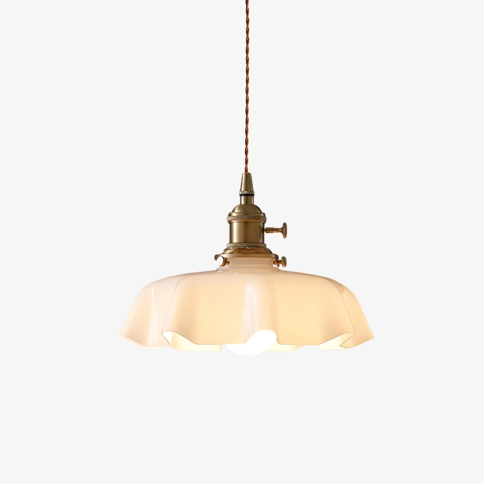 French pendant light with pleated glass shade casting dappled light