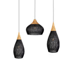 Natural rattan pendant light with wood body over a table