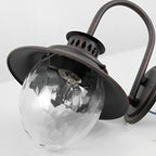 Udendørs væglampe med vintage rust-sort finish, Quenby glasdesign