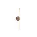 Clérachic wall sconce on white, a pink-brown marbled disc shown close against its slim brass bar.